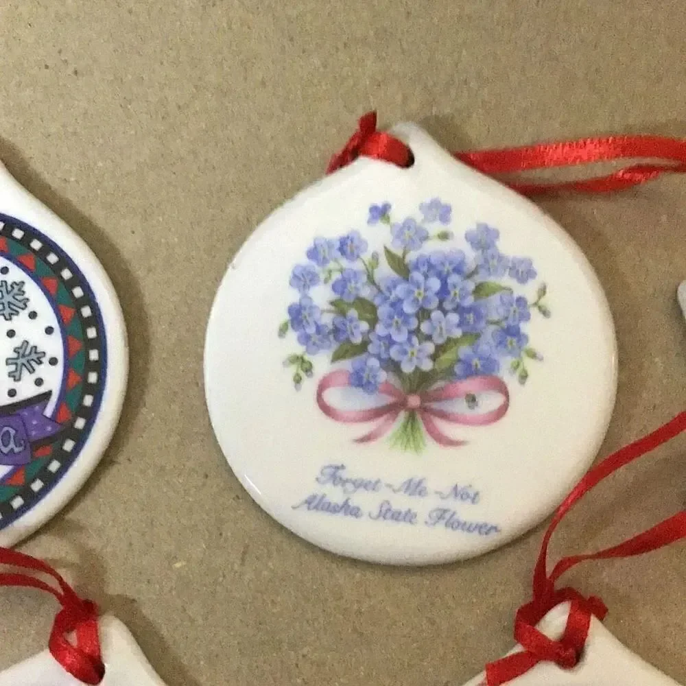 Set of six porcelain desk ornaments mostly Alaskan